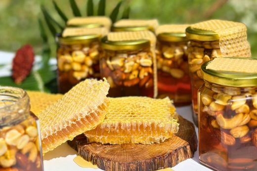 Greek honey jars and honeycomb on a rustic table